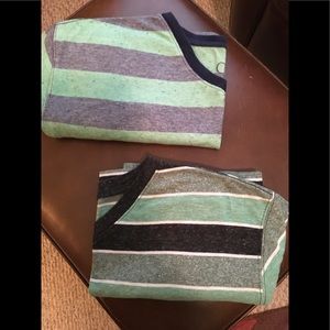 Two men’s v neck shirts